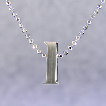 What's your story? Begin with this Little "L" initial, solid Sterling Silver pendant. Wear it alone, with other pendants, or layered with other necklaces. Comes with a sterling silver ball chain, 16 inches long. The pendant measures 1/4 inch long. Too cute!

Signified by a feminine sensibility and optimistic charm, Alex Woo's Little Icon Collections reinvent familiar symbols from the world around us into fresh and expressive designs.

Designed and handcrafted in our studio.