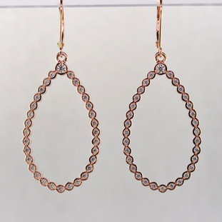 These jaw-dropping and elegant dangle diamond earrings will make you the envy of the party (or office, or grocery store, or...you know). Crafted in 14 karat rose gold, with almost 3/4 carat of sparkling ideal cut diamonds. Set in bezels so they feel soft and smooth, you will feel like a queen with these on your ears! On rose gold lever backs. Measures 2 inches long.

Made in our studio by the artist Stuart J.

These earrings can be customized to be Perfectly You, and can be made in any karat or color of gold, and in platinum.