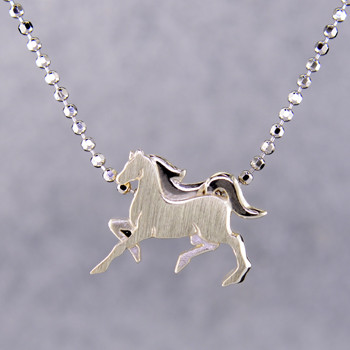 What's your story? Begin with this Little Horse, solid Sterling Silver pendant. Wear it alone, with other pendants, or layered with other necklaces. Comes with a sterling silver ball chain, 16 inches long. The pendant measures 1/4 inch long. Too cute!

Signified by a feminine sensibility and optimistic charm, Alex Woo's Little Icon Collections reinvent familiar symbols from the world around us into fresh and expressive designs.

Designed and handcrafted by Alex Woo in New York City.