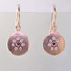 These sweet earrings shimmer when you wear them. Beautiful and warm 14 karat rose gold medallion drops sprinkled with .11ct. of ideal cut diamonds set in a starburst pattern, with a glowing pink sapphire in the center, hanging from wires. 12mm long.
Designed and created in our studio by the artist Stuart J. These sweet earrings shimmer when you wear them. Beautiful and warm 14 karat rose gold medallion drops sprinkled with .11ct. of ideal cut diamonds set in a starburst pattern, with a glowing pink sapphire in the center, hanging from wires. 12mm long.
Designed and created in our studio by the artist Stuart J.