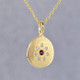 This sweet pendant has a special, hand applied finish that shimmers when you wear it. Beautiful and rich 14 karat yellow gold drop, sprinkled with .06 carat total weight of ideal cut diamonds, with a glowing rhodolite garnet gemstone in the center. Comes with an sixteen inch, 14 karat yellow gold rope chain. Pendant measures 5/8 inches long.   

Designed and created in our studio by the artist Stuart J.