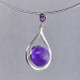 Simple, sophisticated drop dangle tear drop Amethyst pendant in rhodium plated Sterling Silver, with 12mm purple Amethyst cabachon round shape, and on top 1- 3mm round Amethyst round cabachon hanging on a sterling silver oval link chain 18". Measuring 1 1/4 inches long. An Exceptional Value.

Handcrafted in northern Spain.  