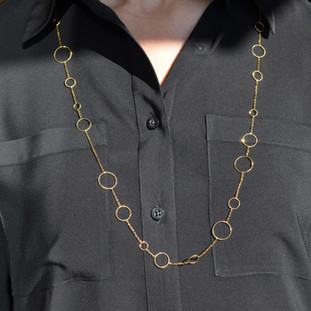 Feels like the 60's all over again.  14 Karat yellow gold circle waterfall chain.  Wearing this will make you feel fun and flirty. Wear with a dress, or a casual shirt, day or night. This chain is 34" long. 