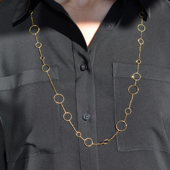 Feels like the 60's all over again.  14 Karat yellow gold circle waterfall chain.  Wearing this will make you feel fun and flirty. Wear with a dress, or a casual shirt, day or night. This chain is 34" long. 