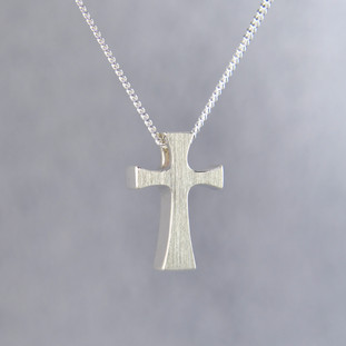 Feel your devotion in divine style with this chunky modern sterling silver cross pendant, perfect for any age. Hanging on a sterling silver curb chain, 18" long, our cross pendant measures 3/4 inches tall by 3/8 inches wide.

Designed and created in our studio by the artist Stuart J.