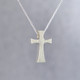Feel your devotion in divine style with this chunky modern sterling silver cross pendant, perfect for any age. Hanging on a sterling silver curb chain, 18" long, our cross pendant measures 3/4 inches tall by 3/8 inches wide.
Designed and created in our studio by the artist Stuart J. Feel your devotion in divine style with this chunky modern sterling silver cross pendant, perfect for any age. Hanging on a sterling silver curb chain, 18" long, our cross pendant measures 3/4 inches tall by 3/8 inches wide.
Designed and created in our studio by the artist Stuart J.