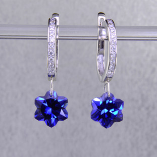What's better than one succulent flower? Two, of course. One for each ear. Exclusively ours, each chatham created blue sapphire flower is custom cut just for us by master gem cutters who know what flowers look like. Each flower measures 8mm, and dangles from the bottom of a 14 karat white gold diamond top, glistening with .09ct. T.W. of ideal cut diamonds. These gorgeous earrings measure 1 inch long, and  hang from white gold lever backs. They are available with a variety of sapphire colors.  Other colors could take up to 8 weeks delivery, but ask anyway!

Designed and handmade by the artist Stuart J.

A Piercette® is a patented method of setting, with a gemstone that moves. The gem is set so that it swivels with every movement of the wearer, exhibiting extra sparkle.


Chatham Gemstones are also available in Ruby, Sapphire, and Alexandrite.


 


                                                                                                                                                                                                                                                                      Chatham® Created Gemstones are grown in carefully controlled laboratory conditions. They are chemically and optically identical to their natural counterparts, yet cost much less. Because the environment in which they are grown is controlled, the imperfections often found in natural gemstones, are absent in Chatham® Created Gemstones. Because of this, and superior cutting, Chatham® gems exhibit the color and sparkle of the finest natural gems. Each one comes with a Certificate of Authenticity, and a Lifetime Warranty.