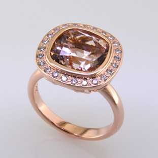 Modern and timeless morganite halo diamond ring, thoughtfully crafted in 14 karat rose gold will light up the room! Set with .24 carat total weight of super sparkly Ideal cut diamonds, and an incredible cushion cut natural morganite gemstone. This morganite and diamond ring has no prongs to worry about, and can be dressed up or down to go with any outfit. A truly spectacular piece, that will never be out of style!

Designed, and created for the gemstone of your choice in our studio, by the artist Stuart J. Call for more information.

Please allow 2-4 weeks for delivery.
