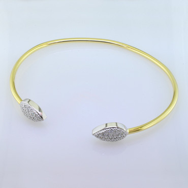 Going out for a dinner date, or just being casual, this cool cuff bracelet fits the bill. Custom made by our talented artist, Stuart J, this bracelet blends yellow gold and white gold seamlessly. A perfect compliment to any outfit, that will layer nicely with your other bracelets. Beautiful ideal cut diamonds set in pear shapes, weigh 0.30 carat T.W., and sparkle like crazy. Hand-made in our studio with recycled gold. What could be better!