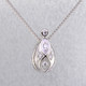 You will feel captivated by the feel of modern and vintage in this elegant diamond pendant. 14 karat white gold with .16 carats of sparkling ideal cut diamonds. This beautiful diamond pendant measures 1/2 inch long, and dangles on a 14 karat white gold 1.1mm wheat chain, 18" long.

Designed and created in our studio by the artist Stuart J.