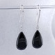 Beautiful Australian Black Jade drop dangle earrings.  We chose these stones for the amazing shiny black color, and that they are known to protect the wearer.  We created these dazzling one of a kind earrings in 14 Karat white gold, added .35ct. of ideal cut diamonds on top, and dangled the Black Jade Pear Shapes on the bottom.  These earrings are simply spectacular!  Hangs on diamond wires, and measures 1 3/4" long.

Designed, and created in our studio by the artist Stuart J.