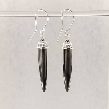 In searching for fun stones, we came across these elegant Australian Black Jade drops. They spoke to us, as do all of our stones! So we used them to create these 14 karat white gold drop earrings, topped with a small halo of Ideal cut diamonds, weighing 0.15 carat. These gorgeous earrings can be worn for day or night! These black jade drop earrings measure 1 1/4" long, and hang on 14 karat white gold wires.

Designed and created in our studio, by the artist Stuart J. Adelman.