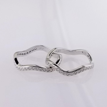 These fitted wedding rings perfectly compliment our Ellie Rose engagement ring. Hand crafted in 14 karat white gold to bring out the color of the rose gold engagement ring, the 2 wedding rings create the perfect frame to show off Ellie Rose to her fullest. In case you only want to get one, they are priced individually. And, of course, we can make them in any color or karat of gold or platinum, or even without diamonds. Where them as a stack-able too! Now there's an idea!

Custom designed and hand crafted in our studio, by the artist Stuart J. Adelman.