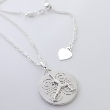 Our Yoga Strength Pendant (shown here with the included adjustable pendant chain) is made from a hand sculpted original, in our studio. Each one is finished by hand, one at a time, in 100% recycled sterling silver. The figure is in the Yoga pose Warrior 1, symbolizing Strength of Mind, strength of Body and strength of Spirit. It is meant to empower, affirm (or reaffirm), and embody the Strength inherent in all women. The symbol behind the hand sculpted figure is the Yoga symbol for Strength, which is to remind you that you are stronger than you think. The reverse side has a special mandala design, feminine, but strong, and is set with a genuine cabochon black onyx, the gemstone of strength. Meant to be worn next to the skin so it links with your power, it will take on your energy, and remind you that your Strength has no limits.

The pendant is the size of a nickel (about 20mm).

A portion of every purchase will help someone through The Give Back Yoga Foundation.

For International orders, any import fees are the responsibility of the purchaser.