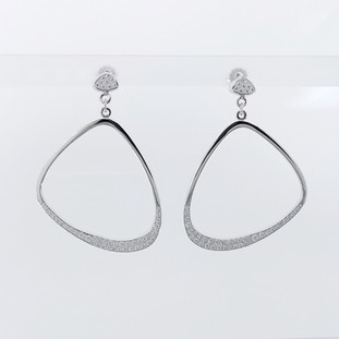 Every girl needs a pair of fabulous diamond hoop earrings. So we created these Unique, diamond hoops in 14 karat white recycled gold, pave' set with super sparkly ideal cut diamonds totaling just over One carat, dangling from diamond pave' studs. Measuring 1 1/4 inches. Truly a must for that special lady, or yourself!

Designed and created in our studio, by the artist Stuart J. Adelman.