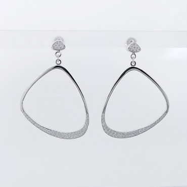 Every girl needs a pair of fabulous diamond hoop earrings. So we created these Unique, diamond hoops in 14 karat white recycled gold, pave' set with super sparkly ideal cut diamonds totaling just over One carat, dangling from diamond pave' studs. Measuring 1 1/4 inches. Truly a must for that special lady, or yourself!

Designed and created in our studio, by the artist Stuart J. Adelman.