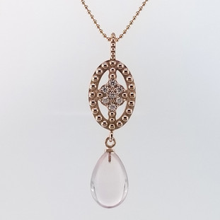 Ancient Civilizations used Rose Quartz in love rituals and ceremonies for centuries, and remains the stone of the hopeless romantic, which is why we love it! So, we created this special drop dangle pendant n the name of love! Handmade in 14 Karat Rose Gold with this mesmerizing pale pink Brazilian Rose Quartz drop, and .21ct. of ideal cut diamonds. Hangs on 14 Karat Rose Gold Beaded Chain 20". This drop dangle pendant measure 1 1/2 ".

Designed, and created in our studio by the artist Stuart J.