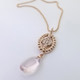 Ancient Civilizations used Rose Quartz in love rituals and ceremonies for centuries, and remains the stone of the hopeless romantic, which is why we love it! So, we created this special drop dangle pendant n the name of love! Handmade in 14 Karat Rose Gold with this mesmerizing pale pink Brazilian Rose Quartz drop, and .21ct. of ideal cut diamonds. Hangs on 14 Karat Rose Gold Beaded Chain 20". This drop dangle pendant measure 1 1/2 ".

Designed, and created in our studio by the artist Stuart J.