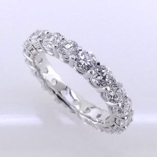 Timeless and elegant diamond eternity band created in 14 karat white gold and surrounded by 19-ideal cut round diamonds totaling 2.28ct.( this is for a size 7 finger, any other sizes are subject to price changes) Call for pricing!  Made in our studio by master artist Stuart J.