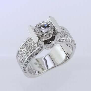  WED-404 A new ring for 25 years of marriage, using her original center diamond.  She said she did not want it blingy!  Hmm...  So beautiful!