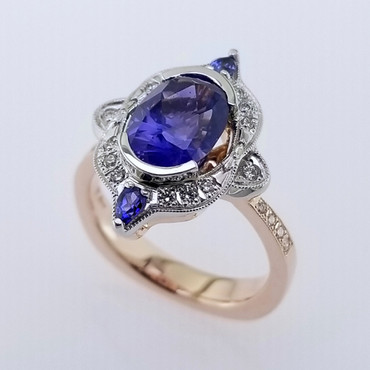 Wed- 400- Custom designed alternative engagement ring using this 2.77 ct. oval no heat sapphire, and mixing white gold, and rose gold. Adding some sparkly diamonds, and 2- pear shaped blue sapphires, makes this ring absolutely perfect! Magnificent!