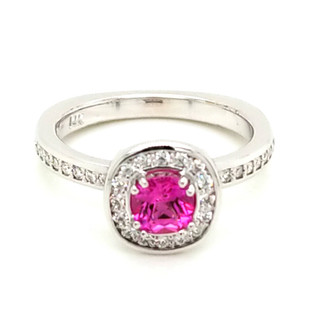 Beautiful, custom made, halo engagement ring in 14 karat white gold, with .25ct. T.W. of ideal cut diamonds, and a .68ct. cushion cut Chatham(r) created, rich, deep pink sapphire gemstone. Simply perfect!
Custom designed in our studio by the artist, Stuart J.  
This elegant ring is available in any karat or color of gold, and in platinum.
Call us for more options.