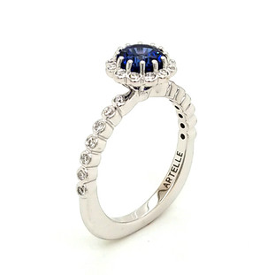 This sweet and delicate halo engagement ring was custom designed for that special person. Created in 14 karat white gold, set with .20ct. T.W. of our perfectly cut and very sparkly lab grown diamonds, and the center set like a delicate flower, holding a 1.17ct. round Chatham(r) lab created, dreamy blue sapphire gemstone. So simple, but so beautiful!
Designed and created in our studio by the artist, Stuart J.
Call us to find out how we can make this gorgeous ring any way you like!