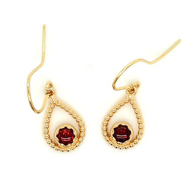 You will be captivated by this mix of modern and vintage in these sweet and sassy dangle earrings. Handmade in 14 karat yellow gold, with rich, buff top garnet gemstones. You will have so much fun wearing them day or night.  Measures 1 inch long and hangs on 14 karat yellow gold wires. 
Designed and created in our studio by the artist, Stuart J.
We can make these with your favorite gemstones