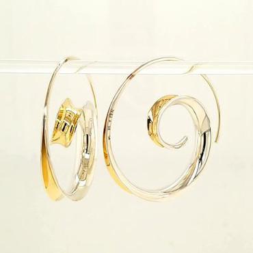 Jewelry to soothe and flow, our Shailee earrings are the perfect hoop with a twist. Hand-forged silver and 18 karat yellow gold. Elegant, casual, and comfortable with a modern flare. These amazing earrings stand 1 1/2 inches tall.

