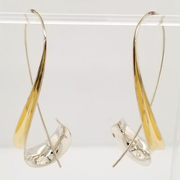 Jewelry to soothe and flow, our Aspen earrings are the perfect earring with a twist. Hand-forged silver and 18 Karat yellow gold. Elegant, casual, and comfortable with a modern flare.  These amazing earrings stand 2 1/2 inches tall.  