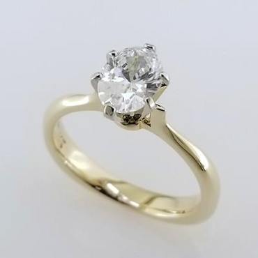 Simplicity at its best, this timeless, but modern 14 karat yellow gold solitare engagement ring is the perfect ring to set off any diamond. We set an 8x6 Oval diamond (sold separately), but we can set any shape, or size you desire. We will even set your diamond.
Available in any color gold, or platinum.
Designed and created in our studio by the artist, Stuart J.