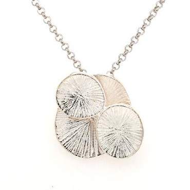  For that down to earth organic girl, this flower pendant is the perfect fit.  Created in silver, with four oval shapes blending together to feel like a flower. Nature at it's best! Hangs on a 18" silver wheat chain. Measures 3/4 inch long.