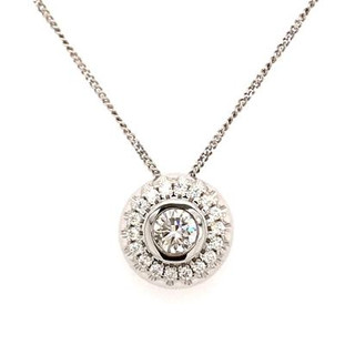 Our beautiful diamond halo pendant made just a little bit different. We created her with a puffed design, making the diamonds look larger. Crafted in 14 karat white gold, with 0.47 carat total weight of ideal cut, super sparkly, diamonds that make this diamond halo pendant sing! Measures 1/4 inch long, and hangs on the included diamond cut, white gold curb chain, 18" long.

Designed and created in our studio by the artist, Stuart J.