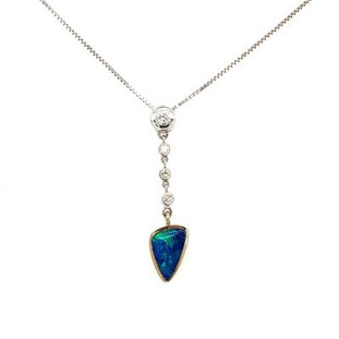Exquisite, hand made, custom designed pendant shows off a dreamy freeform opal doublet from Andamooka, Australia. Crafted in 14 karat white gold, accented with .35 carat (total weight) of ideal cut, super sparkly diamonds, and hanging on the included 14 karat white gold, 18" box chain.

Designed and created in our studio by the artist, Stuart J.