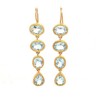 Our stunning dangle earrings will take your breath away! Vermeil (gold plate on sterling silver), with sparkly oval and pear shaped blue topaz gemstones. Measures 2 inches long, hanging on wires.
