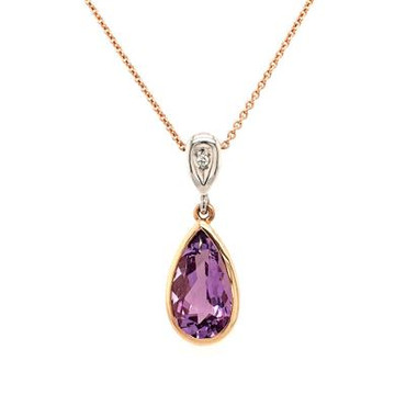 You will be captivated by this modern and elegant pendant. The mix of white gold and 14 karat rose gold is magical as this pendant comes together. The 14 karat rose gold bezel make this beautiful pear shaped amethyst gemstone pop. The blend of the two metals is sophisticated, and fun, all at the same time. Perfect for any time of the day or night. This pendant hangs on a rose gold 18" wheat chain.  The pendant measures 1 inch long.