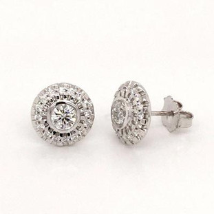 Our beautiful diamond halo earrings made just a little bit different. We created them with a puffed design, making the diamonds look larger. Crafted in 14 karat white gold, with 0.72 carat total weight of ideal cut, super sparkly, diamonds that make these diamond halo earrings sing! Measures 1/4 inch wide, with white gold posts and backs. The perfect diamond stud earring!

Designed and created in our studio by the artist, Stuart J.