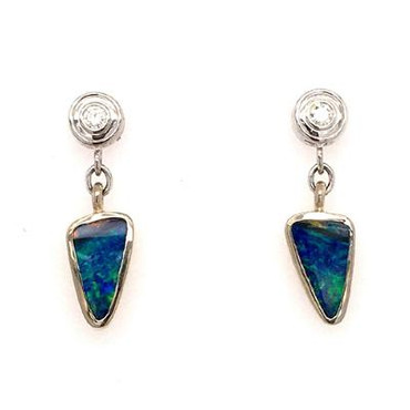 Exquisite, hand made, custom designed earrings shows off these dreamy freeform opal doublets from Andamooka, Australia. Crafted in 14 karat white gold, accented with .14 carat (total weight) of ideal cut, super sparkly diamonds, and hangs on 14 white gold posts and backs.

Designed and created in our studio by the artist, Stuart J.