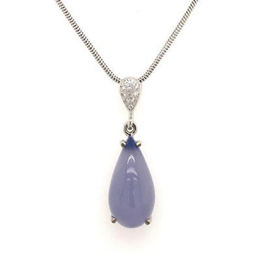 Classic and timeless, this amazing necklace was created in 14 karat white gold, set with our perfect sparkly diamonds, and  this dreamy and very cool blue calcedony gemstone. The perfect necklace to wear day, or night. Hangs on a 1.2mm white gold snake chain 20". This necklace measures 1 1/2 inches long.
Designed and created in our studio, by the artist Stuart J.