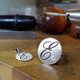 Cherish is our modern take on the timeless initial ring. It signifies how important you are, and symbolizes your name. With our modern round top, and our beautiful scripted initial, etched in black, you will surely be noticed wearing this. Shown here in sterling silver, set with our super sparkly .03ct. lab grown diamond. Measures 3/4 inch wide. This initial ring is also available in 14 karat yellow, white, or rose gold, and is available with all the birthstone colors.

Designed and created in our studio, by the artist Stuart J.