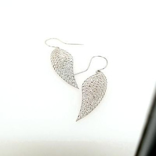 We call these our Angel Wing earrings. They sparkle and shimmer every time you move. Hand crafted in 14 karat white gold, and meticulously set with 3.08 carats T.W. of our super sparkly ideal cut diamonds. Measures 1 1/2 inches long.

Designed and created in our studio by the artist, Stuart J.