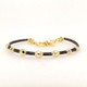 Our beautiful Celestial bracelet with its  yellow gold plated balls, sits on a ruthenium bracelet. Born in Spain, this bracelet feels a little bit edgy, but loads of fun! Measures 1/4" wide, and enlarges for most every wrist size.