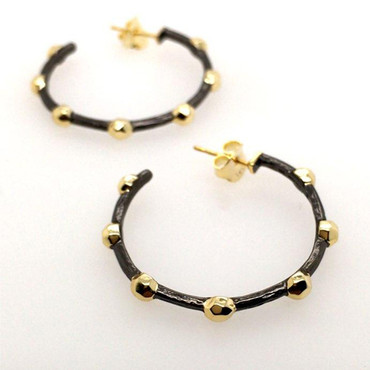 From our celestial collection, these amazing ruthenium and yellow gold plated hoop earrings are fun and edgy, but wearable day or night. Hoops measure 1" around and hangs on posts.