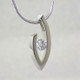 Simple elegance describes this pendant, which shows off a single Diamond to perfection. We can make this piece for any size Diamond and in most shapes - including marquise, pear and oval. Crafted in 14 karat White Gold, this one measures about 1 inch and holds a 0.81ct. F color, VS-2 clarity Diamond, elegantly displayed on a 14 karat White Gold 1.5mm round omega wire necklace, 16 inches long.

Got an extra diamond sitting in a drawer? We know what to do with it.

Please allow 2-3 weeks for delivery.

Designed, and created in our studio by the artist Stuart J.