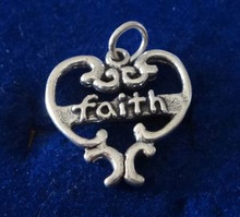 says Faith in a Cut Out Heart Sterling Silver Charm!
