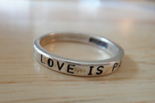 size 5 6 7 8 or 9 says Love is Patient Sterling Silver Ring