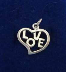 Whimsical Cut out Heart says Love Sterling Silver Charm