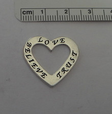 says Love, Trust, & Believe Heart Sterling Silver Charm