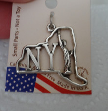 Sterling Silver 23x25mm says NY with Statue of Liberty in New York Shape Charm