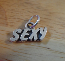 Sterling Silver 8x14mm says the word Sexy on a Charm